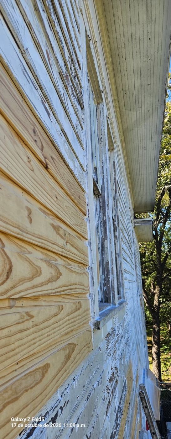 Wood siding scraped and prepared for exterior repainting